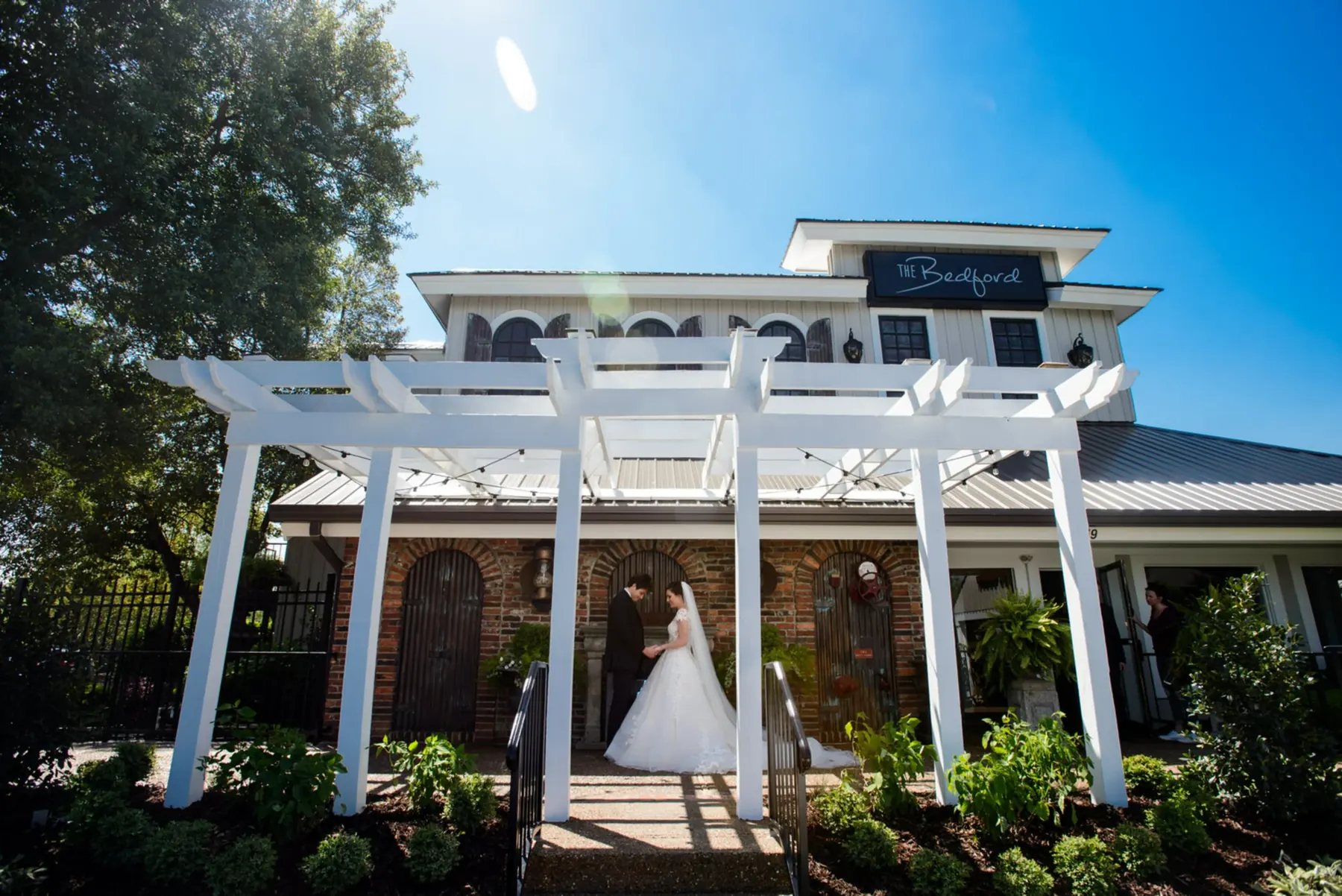 Interior ceremony setup with seating and brick walls at The Bedford (Source: The Bedford)