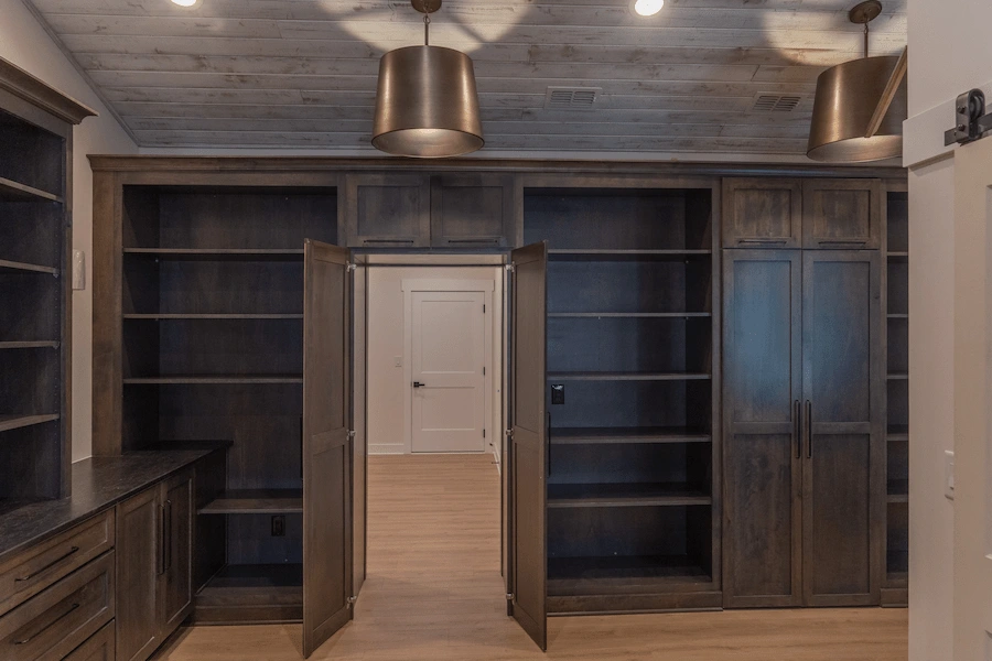 Custom new build - custom office with dark wood shelves and doors